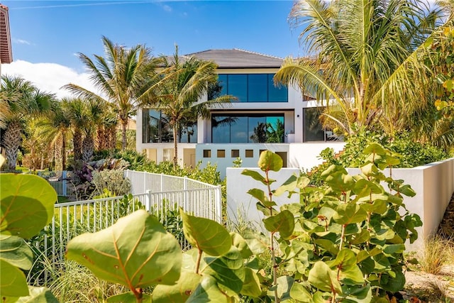 view of home's exterior featuring fence and stucco siding