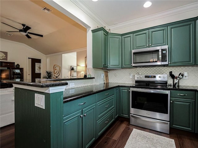 kitchen with green cabinets, ornamental molding, dark wood-style flooring, and stainless steel appliances