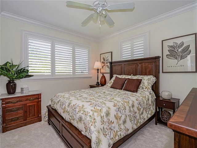 bedroom with ceiling fan, ornamental molding, and light carpet