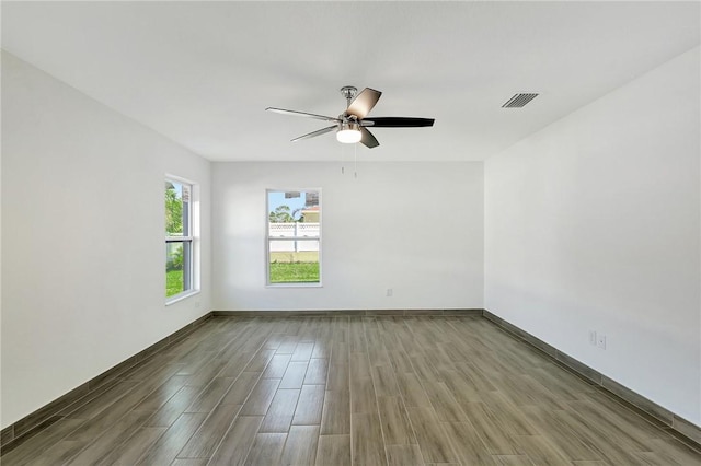 unfurnished room featuring hardwood / wood-style flooring and ceiling fan