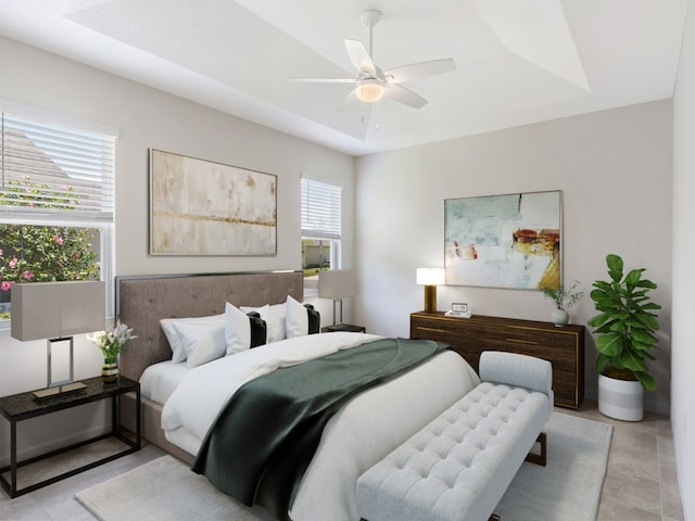 tiled bedroom with a textured ceiling, ceiling fan, and a raised ceiling