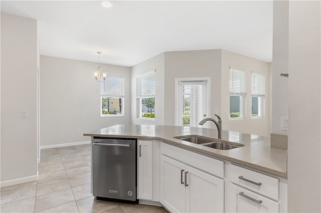 kitchen featuring white cabinetry, sink, light tile patterned floors, decorative light fixtures, and dishwasher