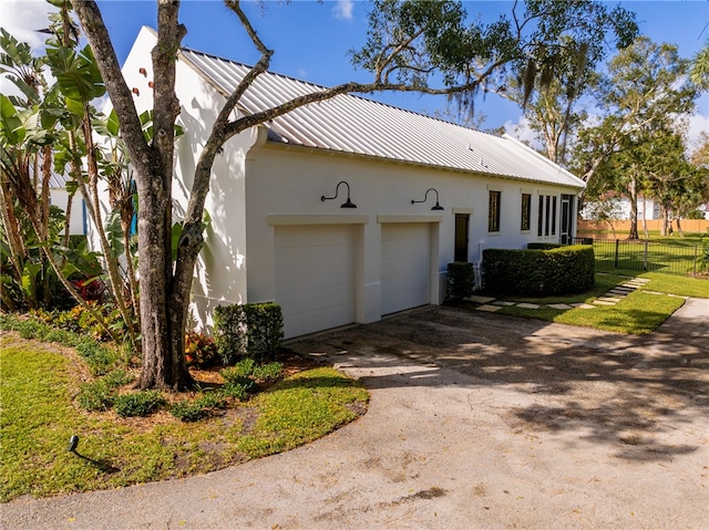 view of side of property with a garage