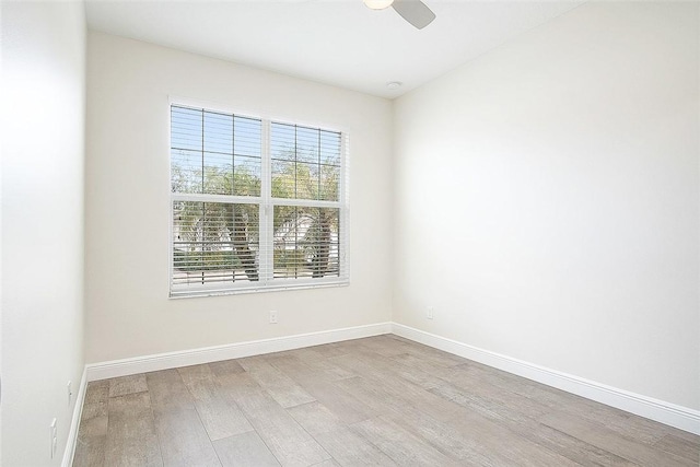 unfurnished room with ceiling fan and light wood-type flooring