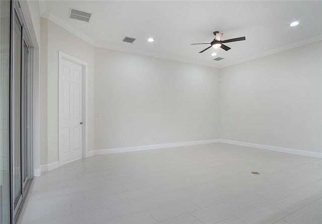 spare room with ceiling fan and crown molding