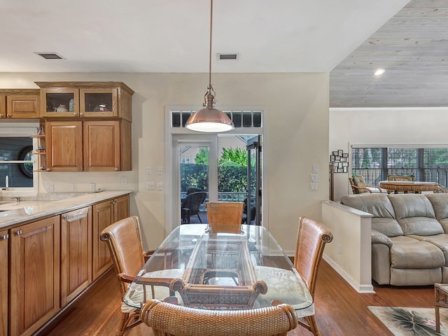 dining space featuring dark hardwood / wood-style flooring