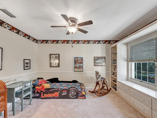 carpeted bedroom with ceiling fan