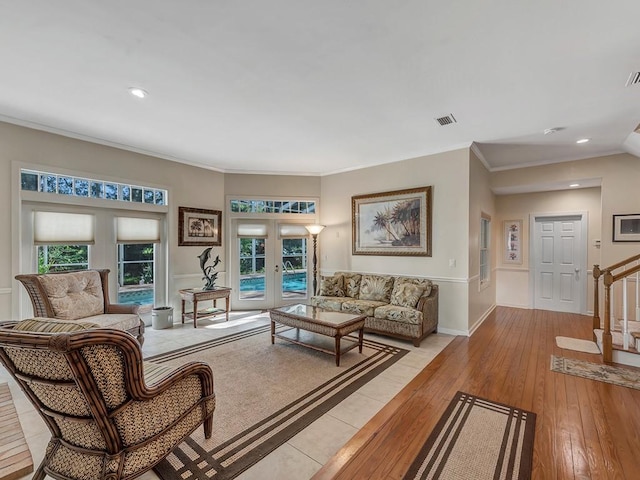1516 50th Ct, Vero Beach, FL 32966 - living area featuring light wood-style floors, crown molding, french doors, stairs, and recessed lighting