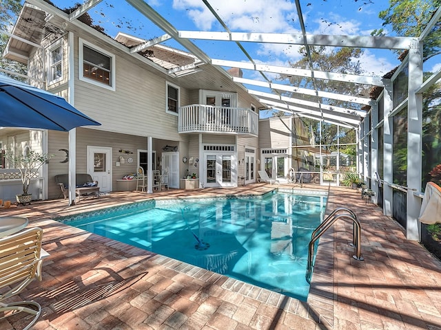 view of pool with a lanai and a patio area