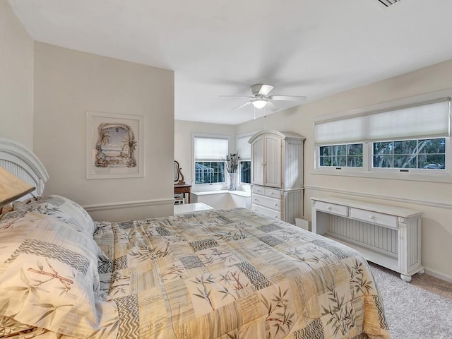 1516 50th Ct, Vero Beach, FL 32966 - bedroom with light carpet and a ceiling fan