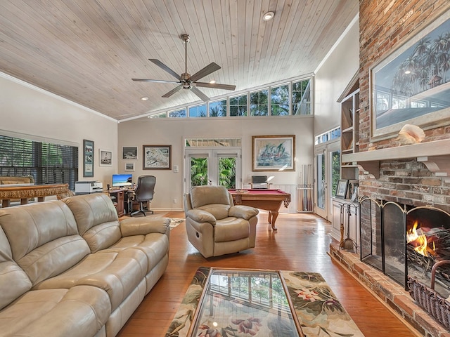 living room with wooden ceiling, a fireplace, and light wood-type flooring