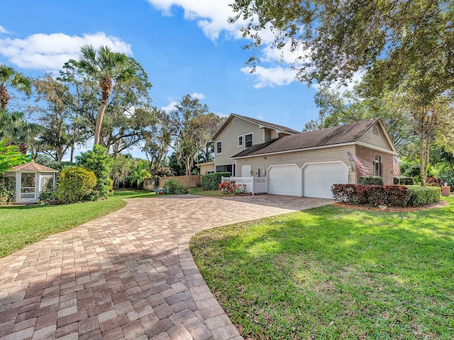 view of property featuring a front lawn