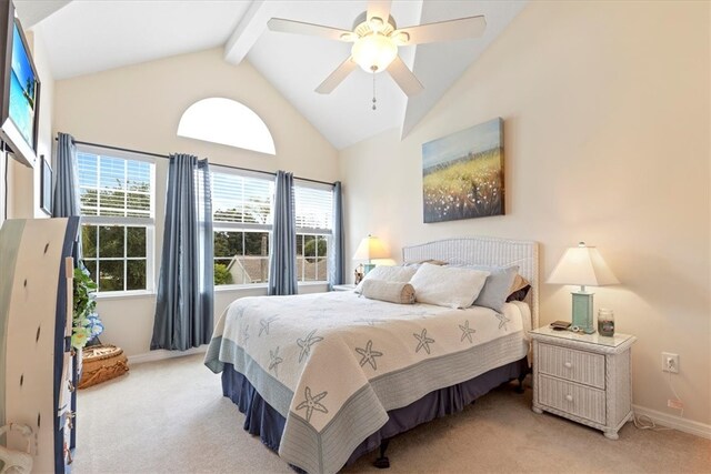 bedroom with ceiling fan, beam ceiling, high vaulted ceiling, and light colored carpet