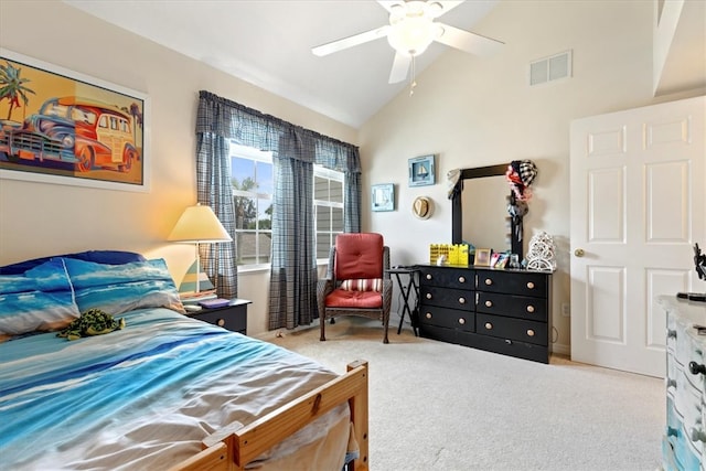 bedroom with ceiling fan, light carpet, and vaulted ceiling