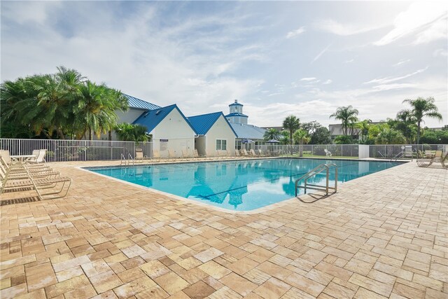 view of pool featuring a patio