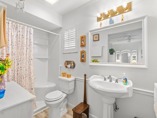 full bathroom with crown molding, ceiling fan, toilet, and wood finished floors