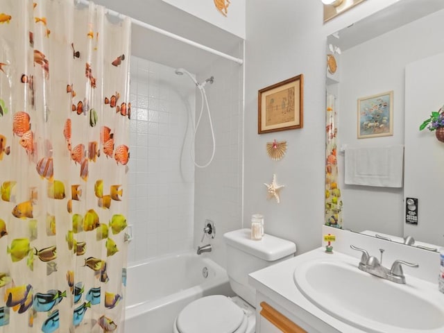 bathroom featuring vanity, shower / bath combination with curtain, and toilet