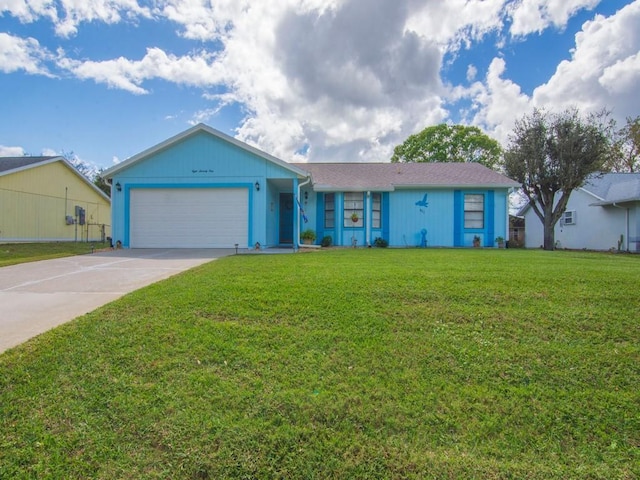 ranch-style home featuring driveway, a front lawn, and an attached garage