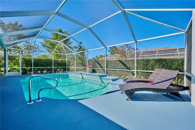 view of pool with a patio area, a fenced in pool, and a lanai