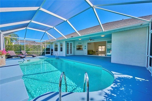 outdoor pool featuring french doors, a patio, a lanai, and a ceiling fan