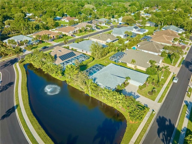 aerial view with a residential view and a water view