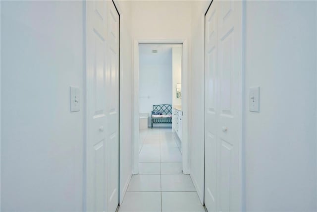 hallway with light tile patterned floors