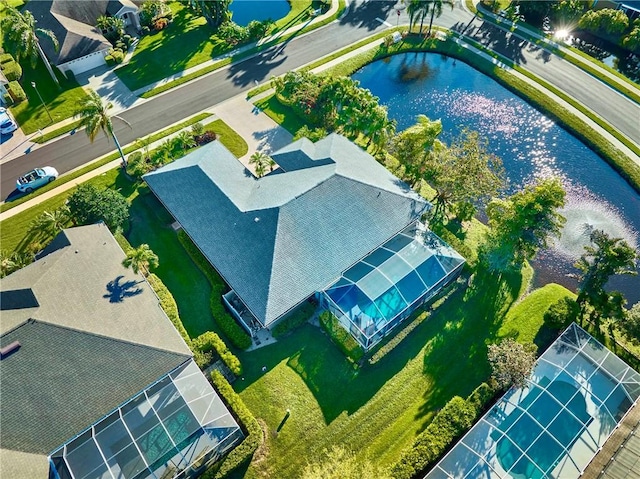 birds eye view of property with a water view