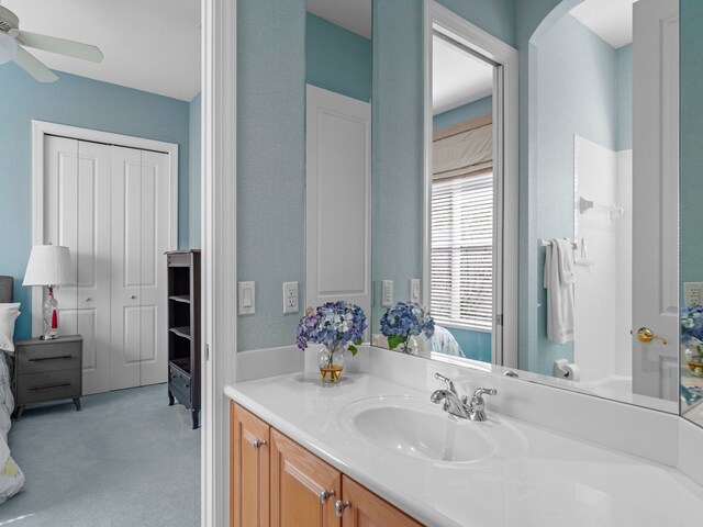 bathroom featuring vanity and ceiling fan