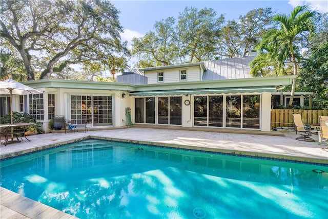 back of house with a patio