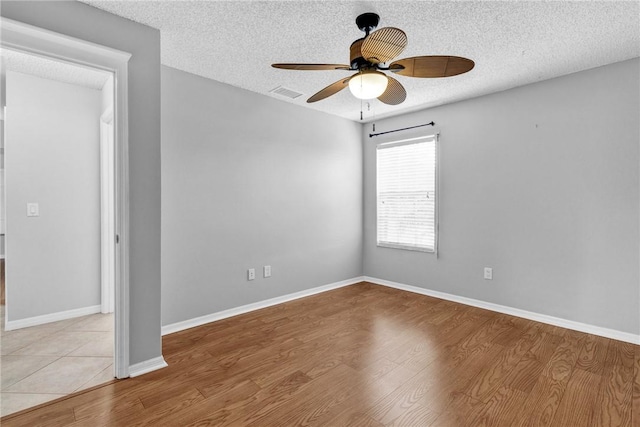 115 Larchmont Ter, Sebastian, FL 32958 - spare room with a ceiling fan, a textured ceiling, and wood finished floors