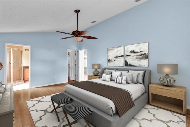 115 Larchmont Ter, Sebastian, FL 32958 - bedroom with vaulted ceiling, a spacious closet, wood finished floors, ceiling fan, and connected bathroom