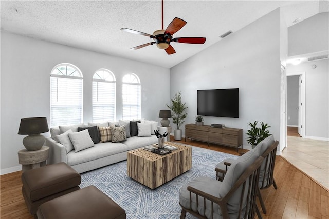 115 Larchmont Ter, Sebastian, FL 32958 - living room featuring ceiling fan, lofted ceiling, and wood finished floors