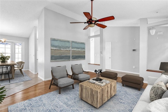 115 Larchmont Ter, Sebastian, FL 32958 - living room with lofted ceiling, wood finished floors, a ceiling fan, and a textured ceiling