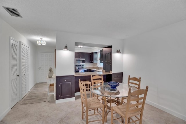 dining space featuring sink