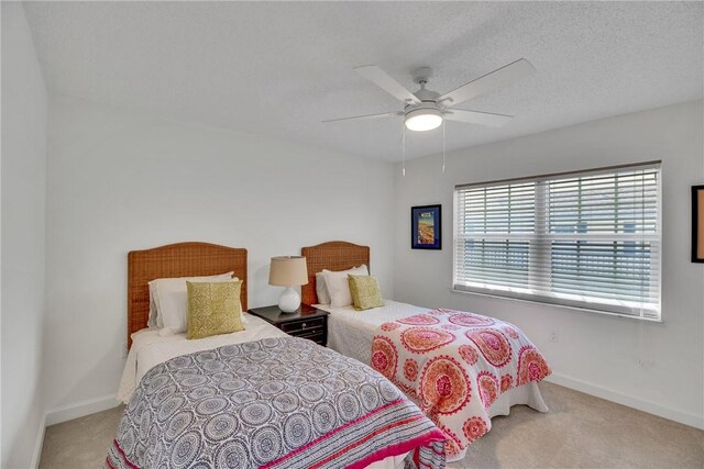 carpeted bedroom featuring ceiling fan and connected bathroom