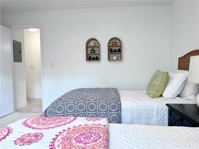 bedroom featuring ceiling fan and light carpet