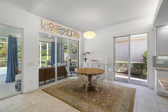 dining room with light tile patterned flooring