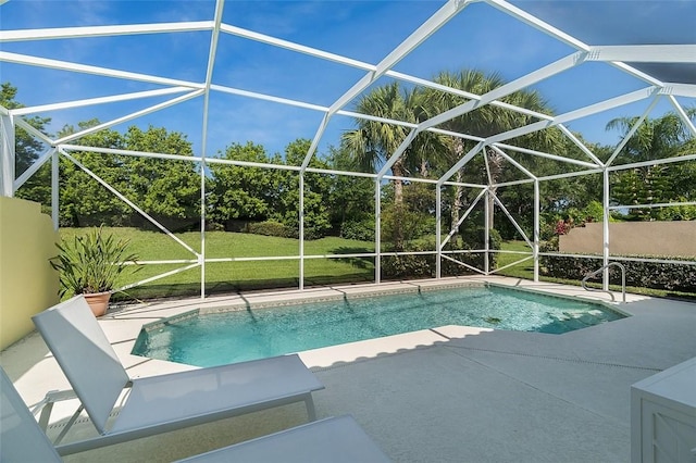 pool with a patio area, a yard, and a lanai