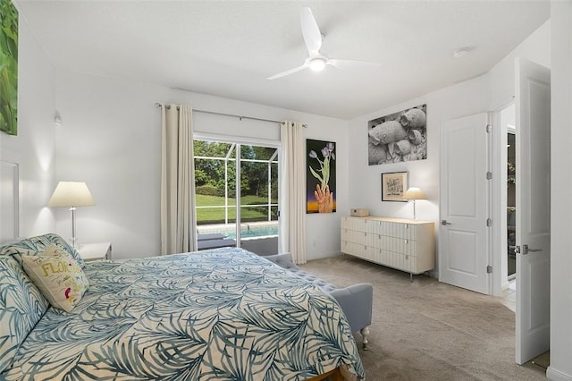 bedroom with access to outside, light colored carpet, and a ceiling fan