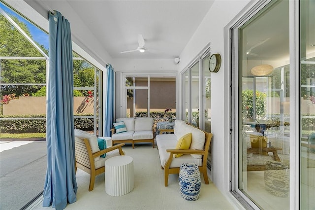 sunroom featuring ceiling fan and an outdoor hangout area