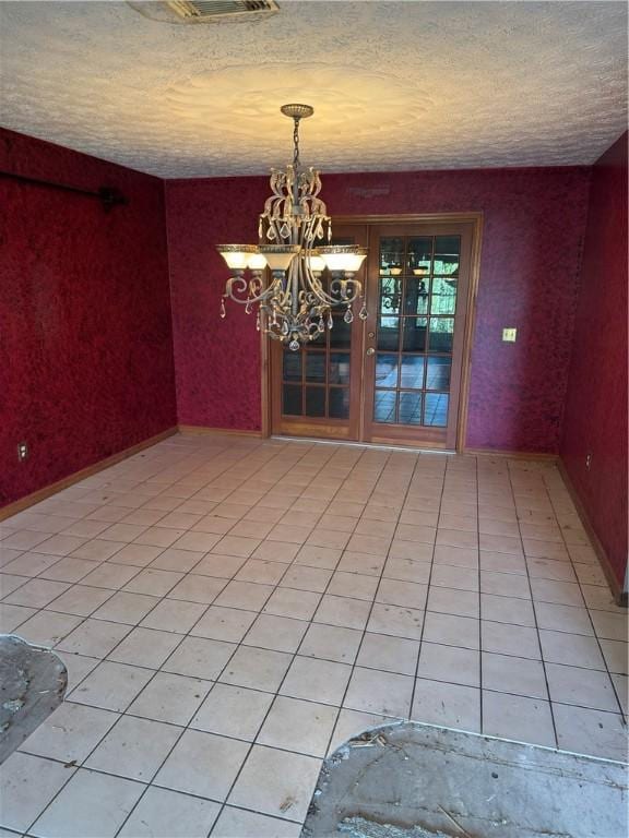 4800 Myrtle Dr, Fort Pierce, FL 34982 - unfurnished dining area with an inviting chandelier, a textured ceiling, and visible vents