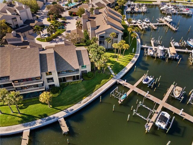 view of side of property with a water view and a yard