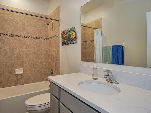 full bathroom with shower / bath combination with curtain, vanity, and toilet