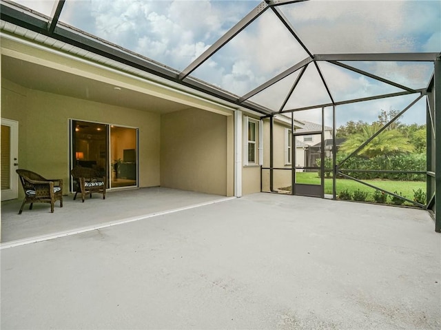 view of patio / terrace featuring a lanai