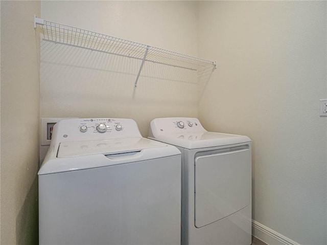 laundry room featuring washing machine and dryer