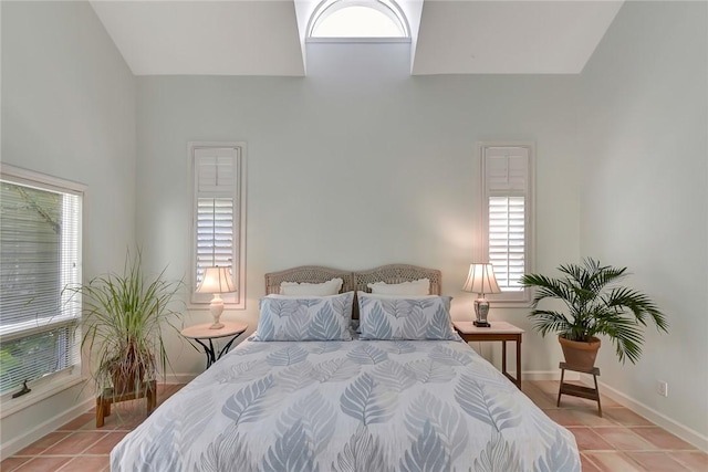 tiled bedroom featuring a towering ceiling