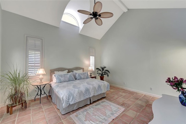 bedroom with ceiling fan, beam ceiling, high vaulted ceiling, and multiple windows