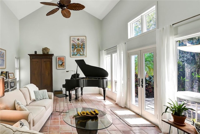 sitting room with french doors, ceiling fan, high vaulted ceiling, and light tile patterned floors