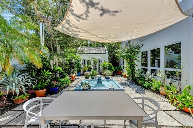 view of patio / terrace with an outbuilding