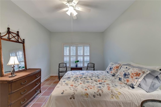 bedroom with tile patterned floors and ceiling fan